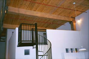The cool steel stairs leading up to the bedroom.