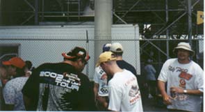 Mike makes some friends with  Jeremy Mayfiled fan while a Ricky Rudd fan looks on while waiting in line